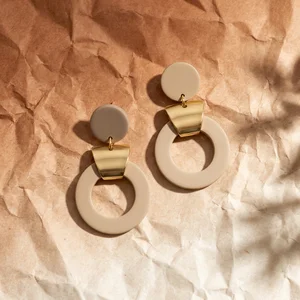 Geometric earrings on crumpled paper