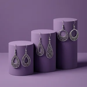 Elegant Earrings on Purple Stands