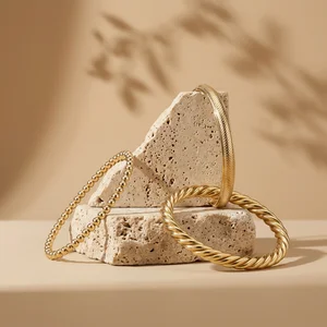 Gold jewelry on natural stone