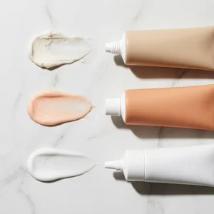 Skincare tubes and smears on marble