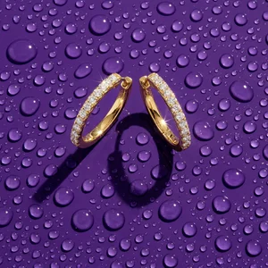 Gold diamond hoops on purple water