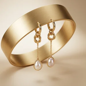 Elegant pearl earrings on gold