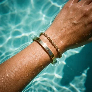 Golden bracelets in pool water
