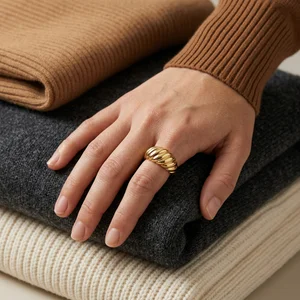 Gold ring on knitwear