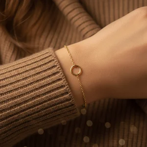 Delicate bracelet on cozy knit