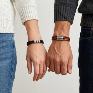 Matching couple bracelets holding hands