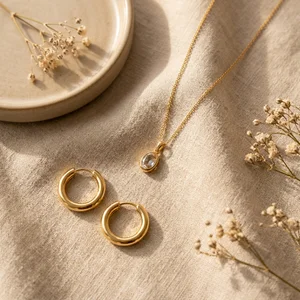Elegant gold jewelry on linen