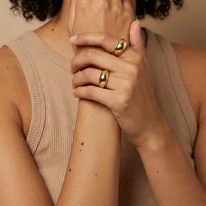 Chunky gold rings on model