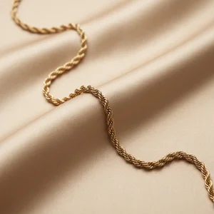 Gold rope chain on silk
