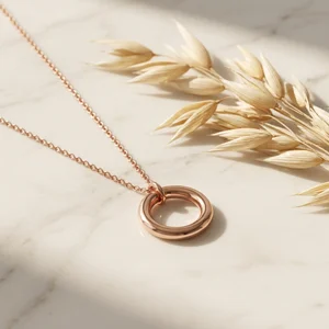 Rose gold necklace on marble
