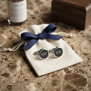 Luxury monogram cufflinks on marble