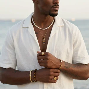 Men's jewelry on beach model