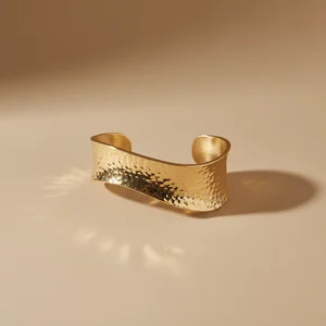 Elegant gold swirl arm cuff