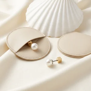 Elegant pearl earrings in leather box