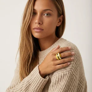 Model wearing ring in beige sweater