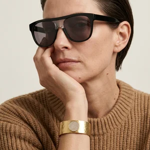 Chic sunglasses and gold cuff