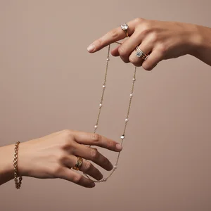 Elegant hand with gold chain