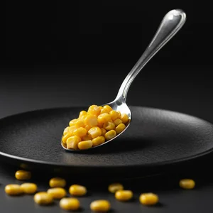 Golden Corn Kernels on Dark Plate