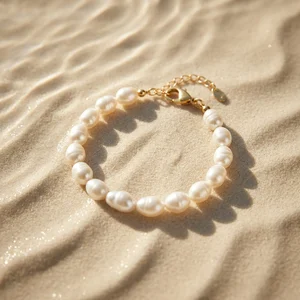 Pearl bracelet on sandy beach