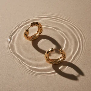 Elegant gold jewelry on water