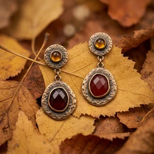 Vintage earrings on autumn leaves