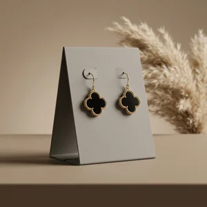 Elegant clover earrings on stand