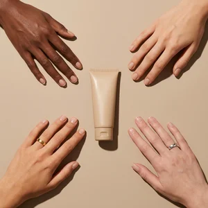 Inclusive hands reaching for tube