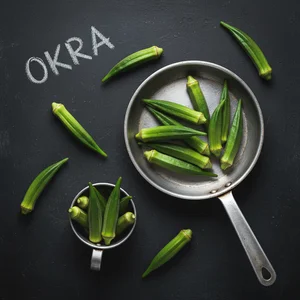 Fresh okra on dark slate