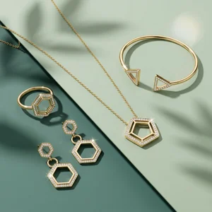 Geometric gold jewelry on green