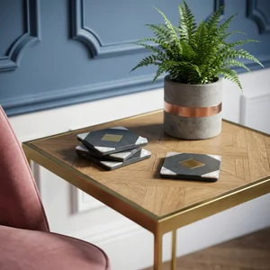 Geometric stone coasters on modern table