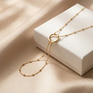 Elegant gold necklace on silk