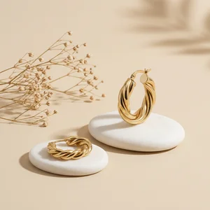 Gold twisted hoops on stones