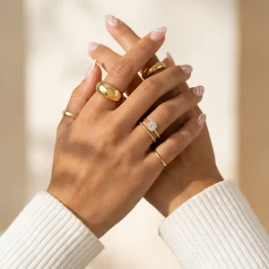 Gold rings on manicured hands
