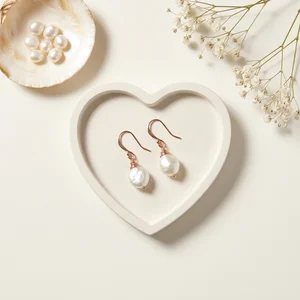 Pearl earrings on heart tray