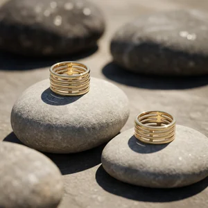 Gold rings on river stones