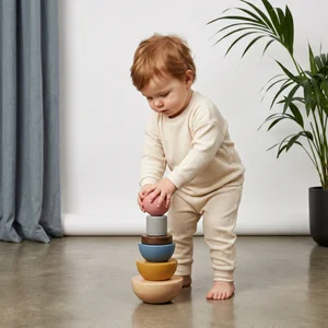 Toddler playing with wooden stacker