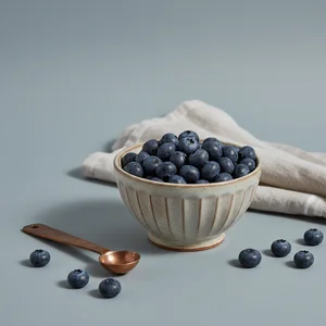 Fresh blueberries in white bowl