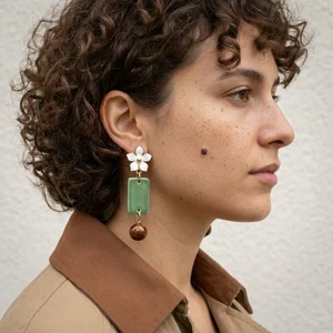 Unique drop earrings on a side profile