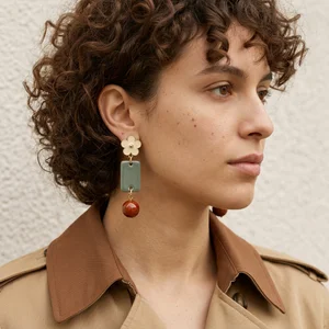 Unique drop earrings on a side profile