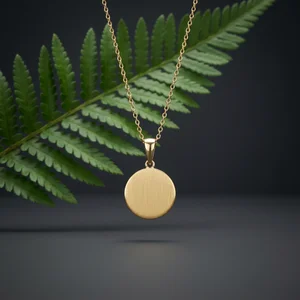 Elegant gold pendant with fern