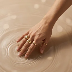 Gold rings in rippling water