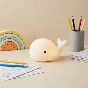 Cute whale night light on desk