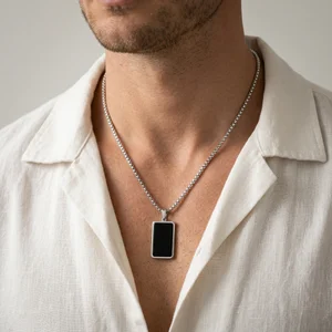 Men's black pendant on model