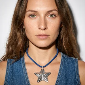 Silver starfish necklace on blue cord