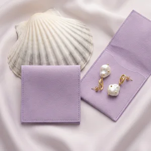 Elegant pearl earrings on satin