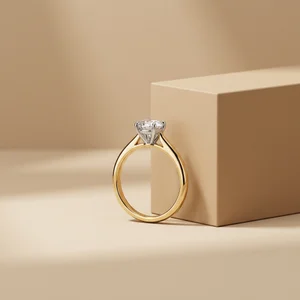 Elegant gold diamond ring on beige
