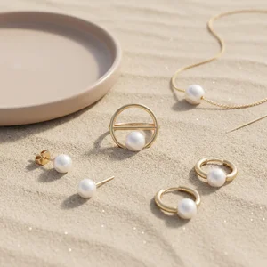 Pearl jewelry collection on sand