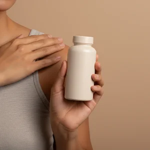 Woman with skincare bottle