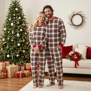 Couple in festive matching plaid pajamas