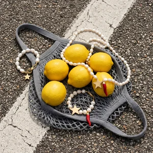Fresh lemons in mesh bag